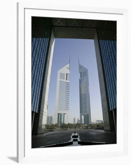 Emirates Towers Through Dubai International Financial Center Arch, Sheikh Zayed Road, Dubai, UAE-Walter Bibikow-Framed Photographic Print