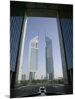 Emirates Towers Through Dubai International Financial Center Arch, Sheikh Zayed Road, Dubai, UAE-Walter Bibikow-Mounted Photographic Print