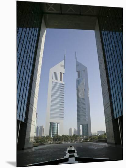 Emirates Towers Through Dubai International Financial Center Arch, Sheikh Zayed Road, Dubai, UAE-Walter Bibikow-Mounted Photographic Print