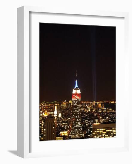Empire State Building in Red, White and Blue as Columns of Light Soar from World Trade Center Site-null-Framed Photographic Print