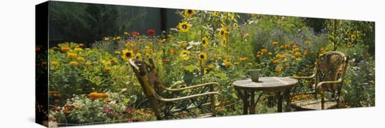 Empty Chairs and a Table in a Garden, Taos, New Mexico, USA-null-Stretched Canvas