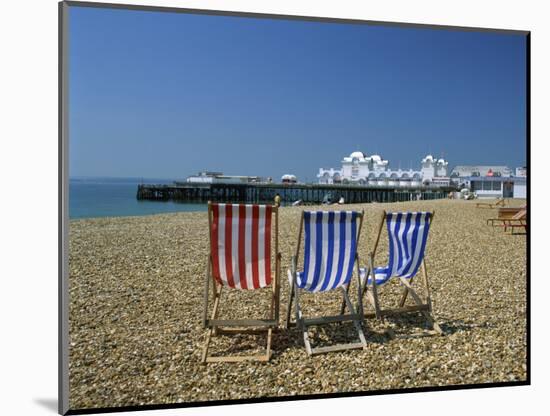 Empty Deck Chairs on the Beach and the Southsea Pier, Southsea, Hampshire, England, United Kingdom-Nigel Francis-Mounted Photographic Print