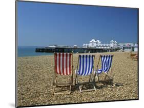 Empty Deck Chairs on the Beach and the Southsea Pier, Southsea, Hampshire, England, United Kingdom-Nigel Francis-Mounted Photographic Print