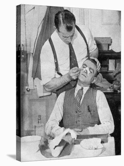 England Captain Eddie Hapgood Receives Treatment for a Broken Nose after a Match with Italy, 1934-null-Stretched Canvas