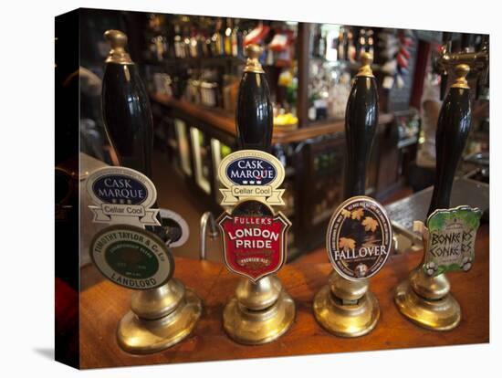 England, London, Beer Pump Handles at the Bar Inside Tradional Pub-Steve Vidler-Stretched Canvas
