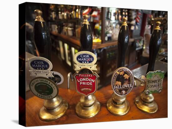 England, London, Beer Pump Handles at the Bar Inside Tradional Pub-Steve Vidler-Stretched Canvas