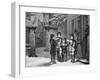 Engraving of Carol Singers in Winter by E. Rosch-null-Framed Premium Photographic Print