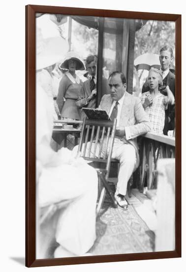 Enrico Caruso Leans Back on Chair Holding a Board with Music-null-Framed Art Print