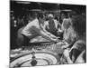 Entertainer Dean Martin Acting as Dealer at a Casino-Allan Grant-Mounted Premium Photographic Print