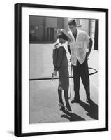 Entertainer Dean Martin Talking with Actress Pier Angeli on the Lot of a Studio-Allan Grant-Framed Premium Photographic Print