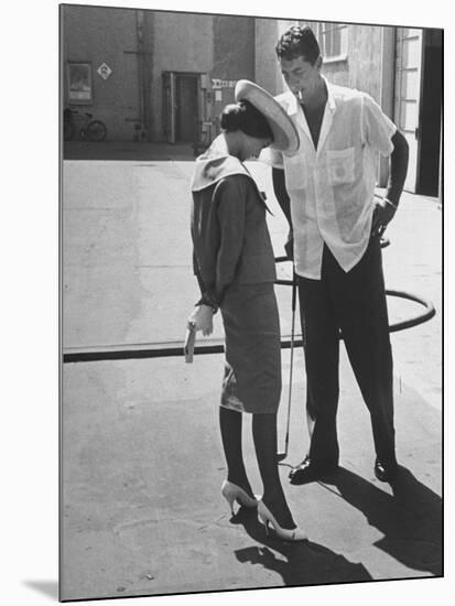 Entertainer Dean Martin Talking with Actress Pier Angeli on the Lot of a Studio-Allan Grant-Mounted Premium Photographic Print