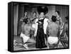 Entertainer Mae West Making Her Nightclub Debut with Loin-Clothed Dancers at Hotel Sahara-Loomis Dean-Framed Stretched Canvas