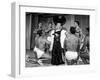 Entertainer Mae West Making Her Nightclub Debut with Loin-Clothed Dancers at Hotel Sahara-Loomis Dean-Framed Photographic Print