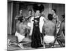 Entertainer Mae West Making Her Nightclub Debut with Loin-Clothed Dancers at Hotel Sahara-Loomis Dean-Mounted Photographic Print