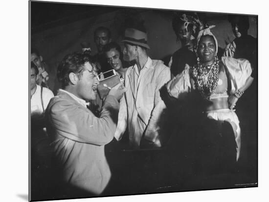Entertainer Orson Welles Filming the Rio de Janerio Carnival Celebration-Hart Preston-Mounted Premium Photographic Print