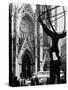 Entrance to St. Patrick's Visible Across Fifth Avenue, with Atlas Statue Silhouetted in Foreground-Andreas Feininger-Stretched Canvas