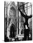 Entrance to St. Patrick's Visible Across Fifth Avenue, with Atlas Statue Silhouetted in Foreground-Andreas Feininger-Stretched Canvas