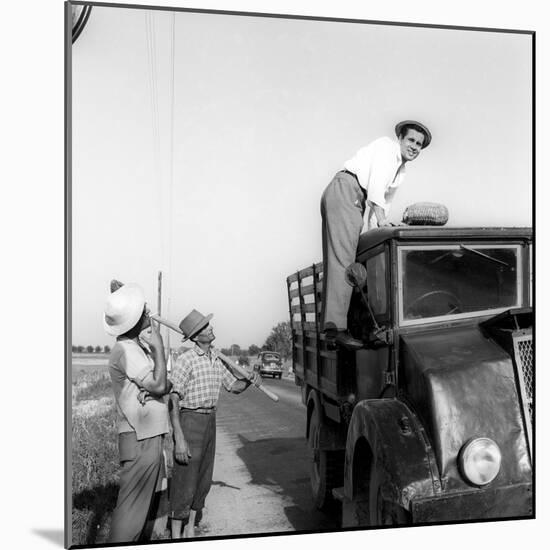 Enzo Tortora Standing on a Truck Observed by Two Farmers-null-Mounted Photographic Print