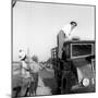 Enzo Tortora Standing on a Truck Observed by Two Farmers-null-Mounted Photographic Print