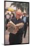 Episcopalian Priest Reading a Newspaper While Walking in Street, New York City-Vernon Merritt III-Mounted Photographic Print