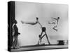 Erik Flensted Jensen, Coach of Danish Gymnastic Team, Watching as Three Men Perform-Gjon Mili-Stretched Canvas