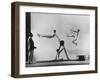 Erik Flensted Jensen, Coach of Danish Gymnastic Team, Watching as Three Men Perform-Gjon Mili-Framed Photographic Print