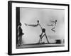 Erik Flensted Jensen, Coach of Danish Gymnastic Team, Watching as Three Men Perform-Gjon Mili-Framed Photographic Print