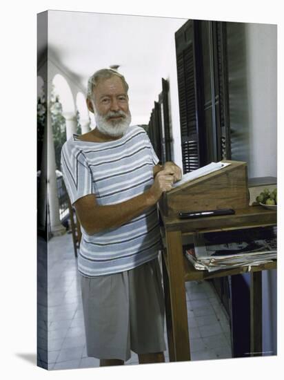 Ernest Hemingway at the Standing Desk on the Balcony of Bill Davis's Home Near Malaga-Loomis Dean-Stretched Canvas