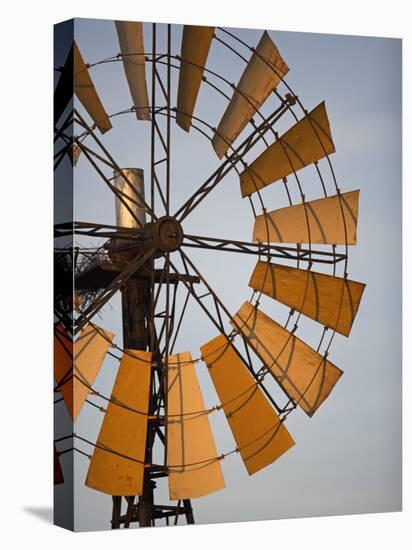 Erongo Region, Okahandja, the Fins of a Windmill Highlighted by the Setting Sun, Namibia-Mark Hannaford-Stretched Canvas