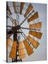 Erongo Region, Okahandja, the Fins of a Windmill Highlighted by the Setting Sun, Namibia-Mark Hannaford-Stretched Canvas