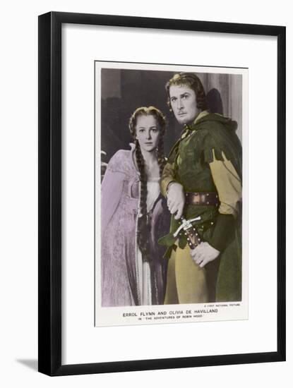 Erroll Flynn as Robin and Olivia de Havilland as Maid Marian in "The Adventures of Robin Hood" 1938-null-Framed Art Print