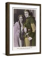 Erroll Flynn as Robin and Olivia de Havilland as Maid Marian in "The Adventures of Robin Hood" 1938-null-Framed Art Print