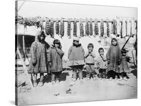 Eskimo Children in front of Dried Salmon Photograph - Alaska-Lantern Press-Stretched Canvas