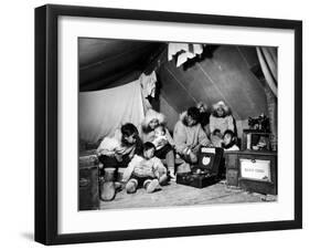 Eskimo Family Admiring their Modern Conveniences, a Victrola, a Sewing Machine and a Stove-Margaret Bourke-White-Framed Photographic Print