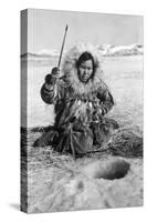 Eskimo Woman Fishing through Ice in Alaska Photograph - Alaska-Lantern Press-Stretched Canvas