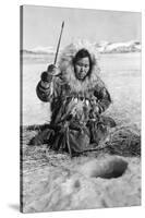 Eskimo Woman Fishing through Ice in Alaska Photograph - Alaska-Lantern Press-Stretched Canvas