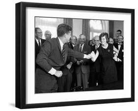 Eunice Shriver Receives a Signing Pen from Her Brother, President John Kennedy-null-Framed Photo