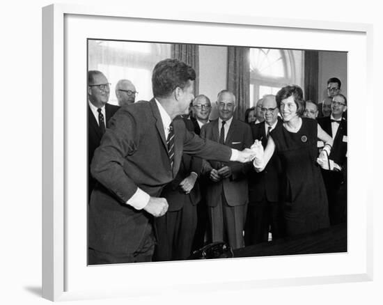 Eunice Shriver Receives a Signing Pen from Her Brother, President John Kennedy-null-Framed Photo