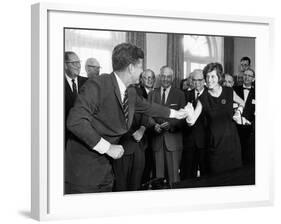 Eunice Shriver Receives a Signing Pen from Her Brother, President John Kennedy-null-Framed Photo