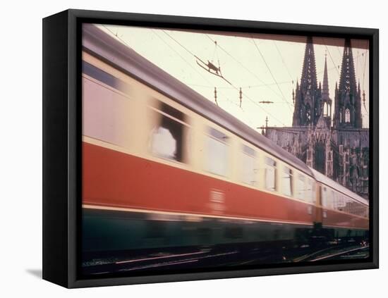 Eurailpass in Europe: Germany's Parsifal Express Speeding Past Cologne Cathedral-Carlo Bavagnoli-Framed Stretched Canvas