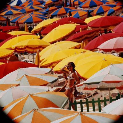 Europe Beach Scene Crowded with Colorful Umbrellas and a Bikini-Clad Young  Woman' Photographic Print - Ralph Crane | AllPosters.com