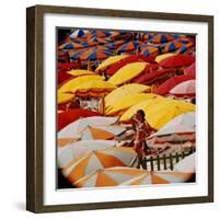 Europe Beach Scene Crowded with Colorful Umbrellas and a Bikini-Clad Young Woman-Ralph Crane-Framed Photographic Print