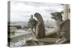 Europe, France, Paris. Two Gargoyles on the Notre Dame Cathedral-Charles Sleicher-Stretched Canvas