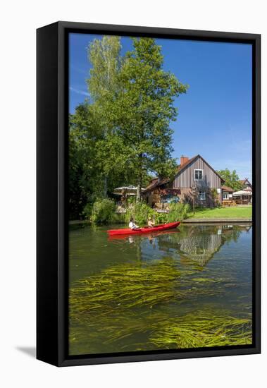 Europe, Germany, Brandenburg, Spreewald, Leipe, Traditional Houses at Water Channel, Canoeists-Chris Seba-Framed Stretched Canvas