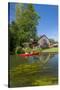 Europe, Germany, Brandenburg, Spreewald, Leipe, Traditional Houses at Water Channel, Canoeists-Chris Seba-Stretched Canvas