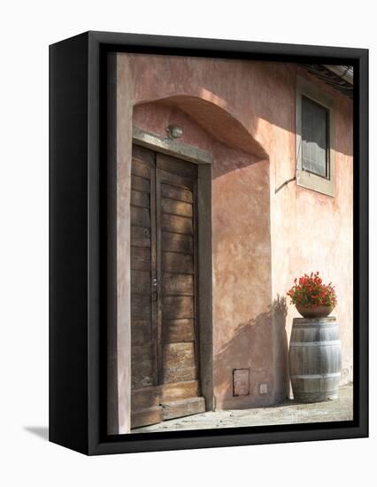 Europe, Italy, Tuscany. Flower Pot on Old Wine Barrel at Winery-Julie Eggers-Framed Stretched Canvas