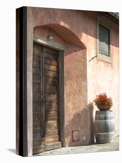 Europe, Italy, Tuscany. Flower Pot on Old Wine Barrel at Winery-Julie Eggers-Stretched Canvas