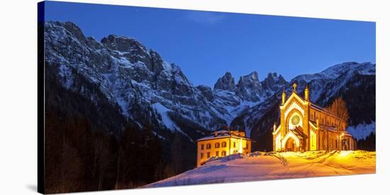 Europe, Italy, Veneto. The parish church of Falcade in the late evening with behind the towers of F-ClickAlps-Stretched Canvas