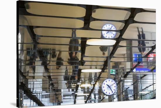 Europe, Netherlands, Amsterdam. Commuters reflected in ceiling of central train station.-Jaynes Gallery-Stretched Canvas