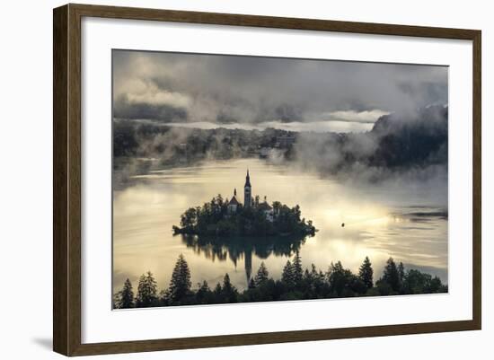 Europe, Slovenia, Bled - A Pletna Boat Arriving At The Island Of Lake Bled During A Foggy Sunrise-Aliaume Chapelle-Framed Photographic Print